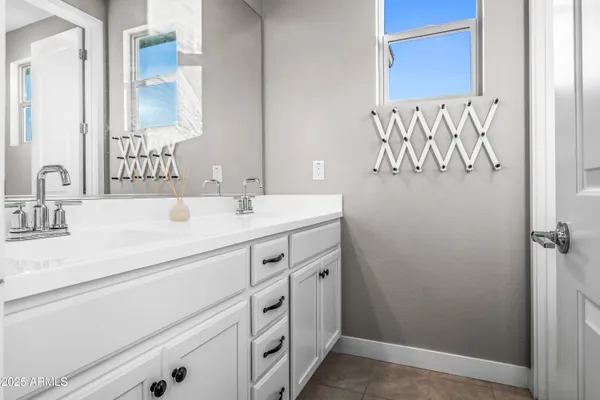 a house view with a seating space and swimming pool in the back