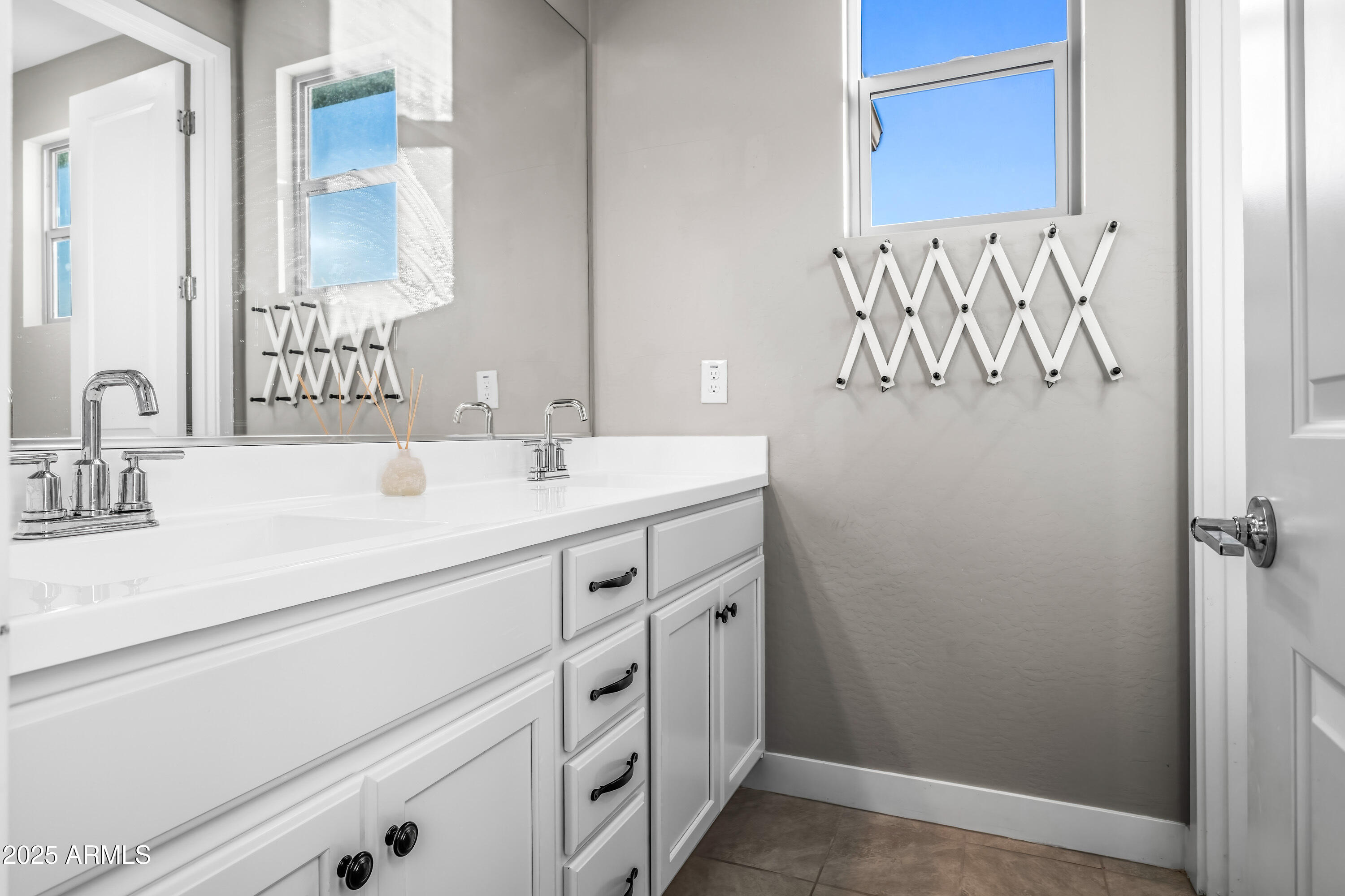 22211 North 31st Street Phoenix, AZ 85050 - Photo 44 of 94 a bathroom with a sink and a mirror