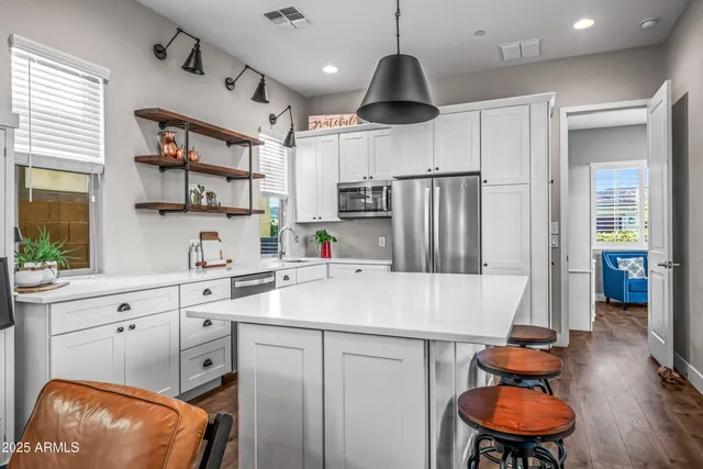 a view of swimming pool with seating area