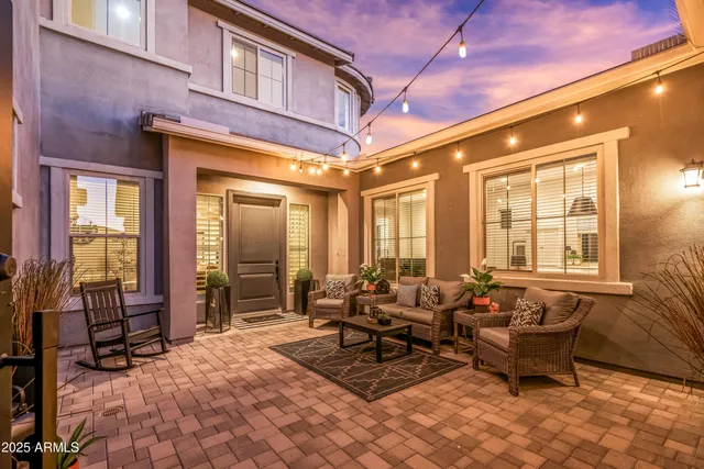 a view of a chairs and table in the patio