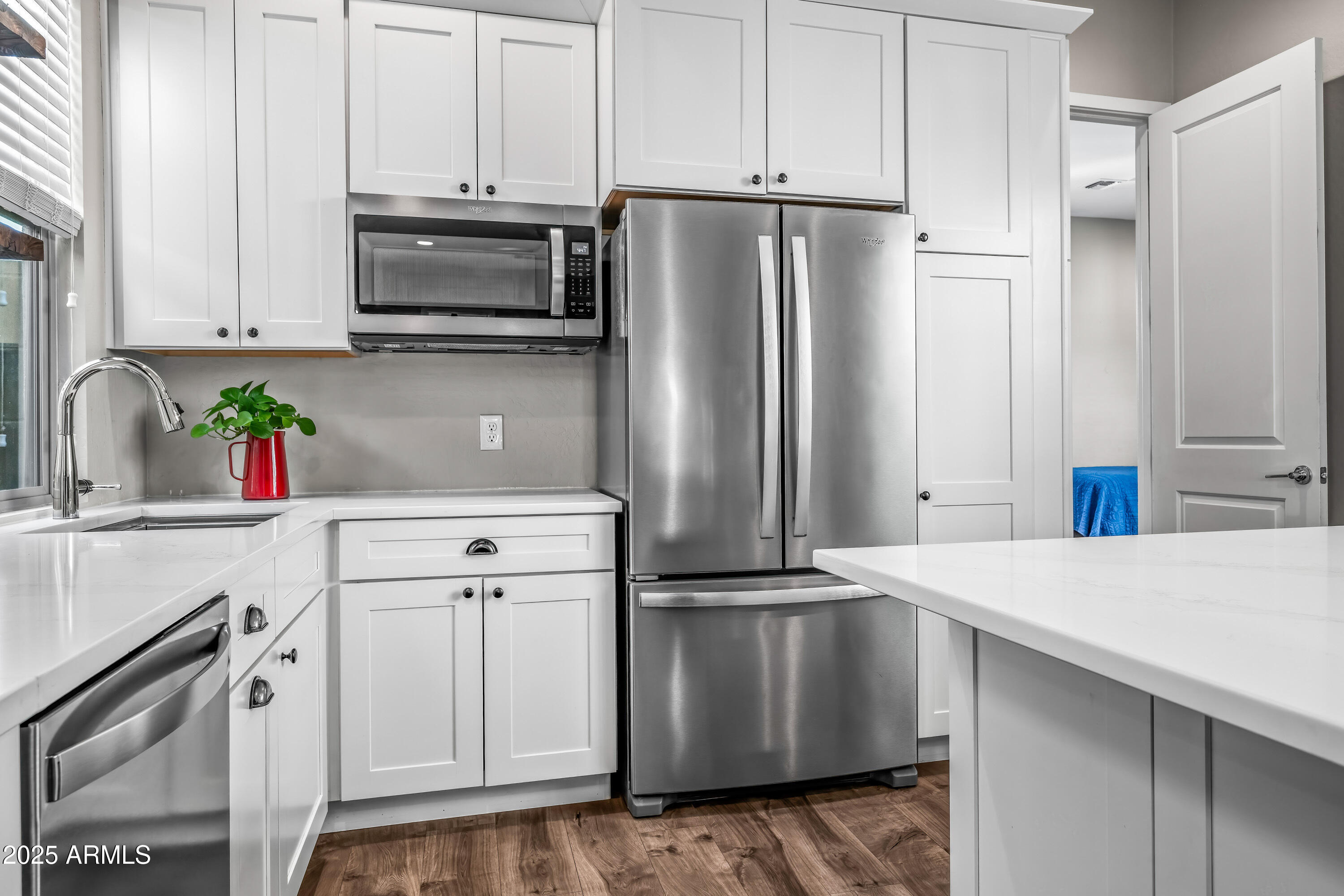 22211 North 31st Street Phoenix, AZ 85050 - Photo 49 of 94 a kitchen with stainless steel appliances a refrigerator sink and microwave