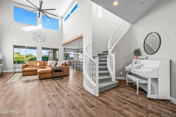 a balcony with furniture and large windows