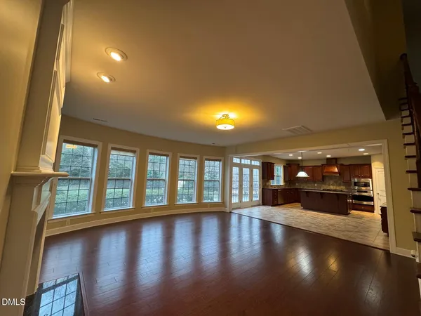 a view of an entryway with wooden floor
