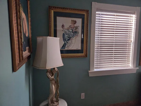 a white toilet sitting next to a window