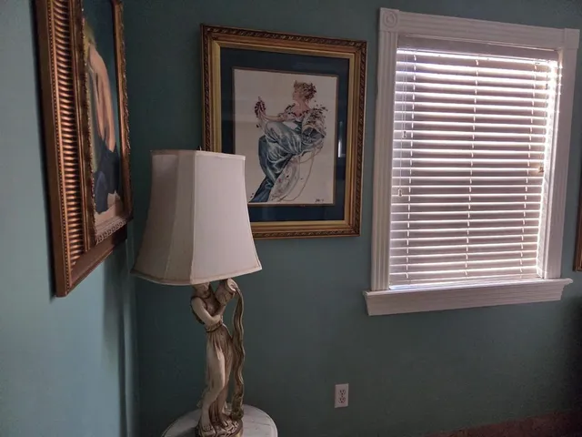 a white toilet sitting next to a window
