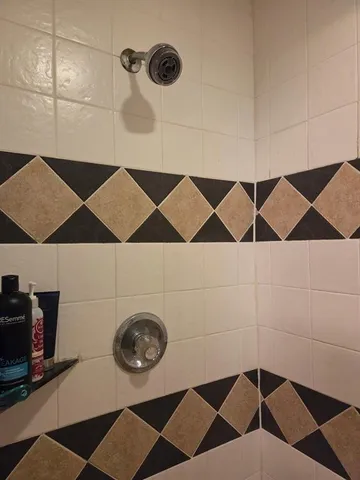 a bathroom with a sink and a shower curtain