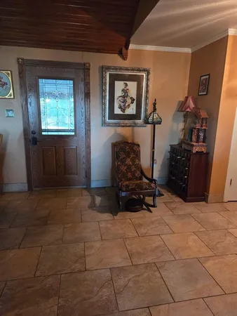 a room with gym equipment and a window