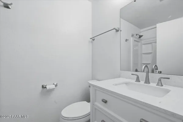 a bathroom with a sink toilet and vanity