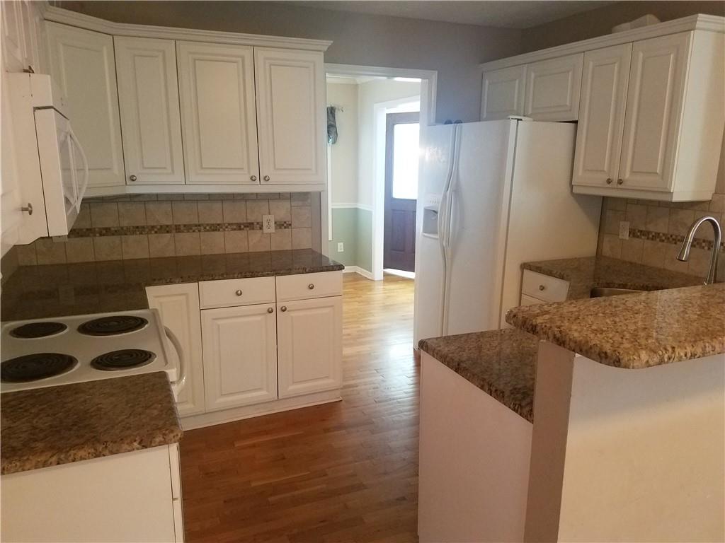 200 Jacksons Run Morganton, NC 28655 - Photo 5 of 7 a kitchen with granite countertop white cabinets and refrigerator