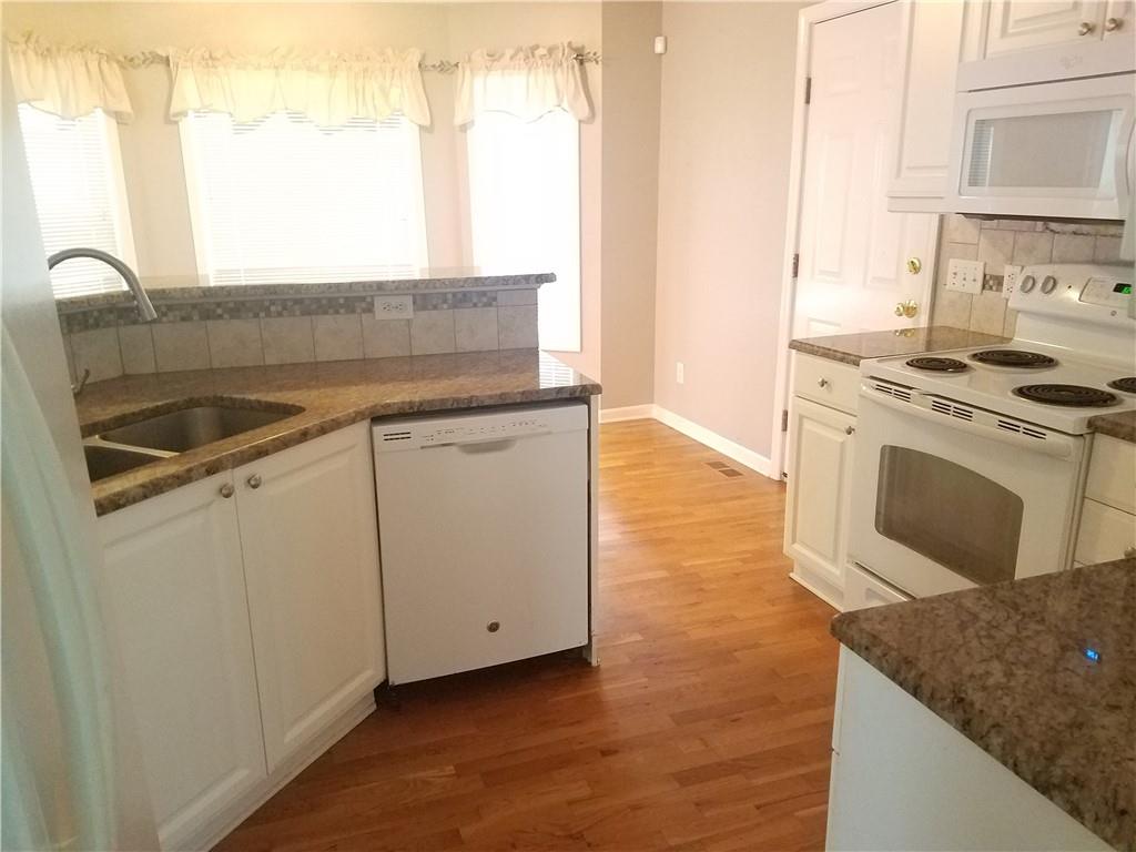 200 Jacksons Run Morganton, NC 28655 - Photo 7 of 7 a kitchen with granite countertop a sink stove and cabinets