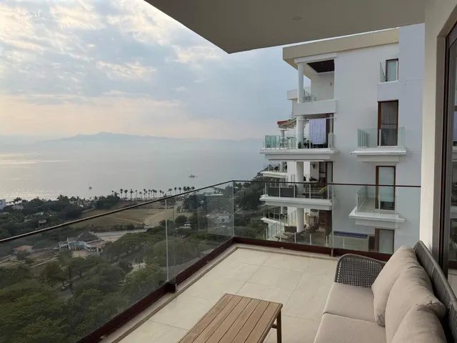 a view of balcony with furniture