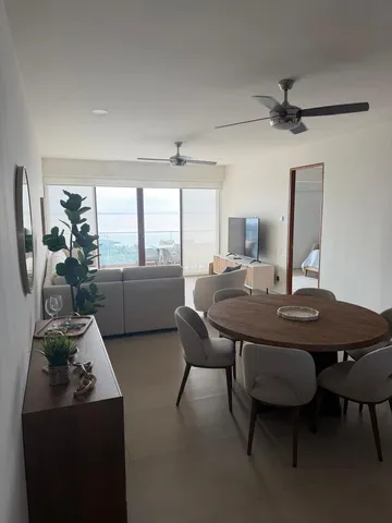 a view of a dining room with furniture window and outside view