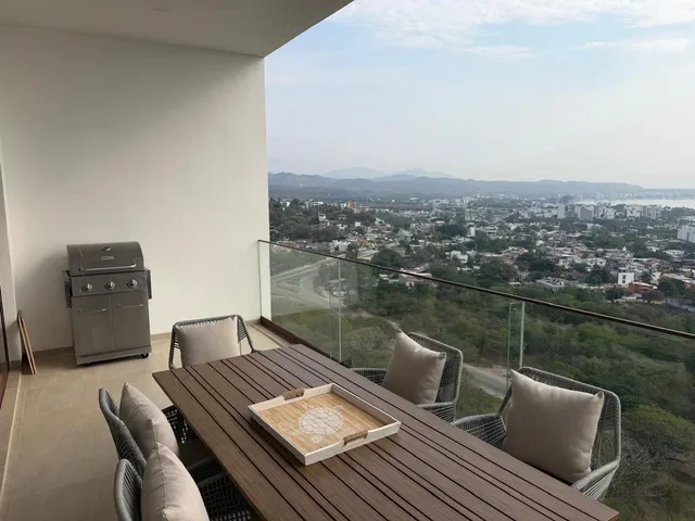 a view of a balcony with two chairs