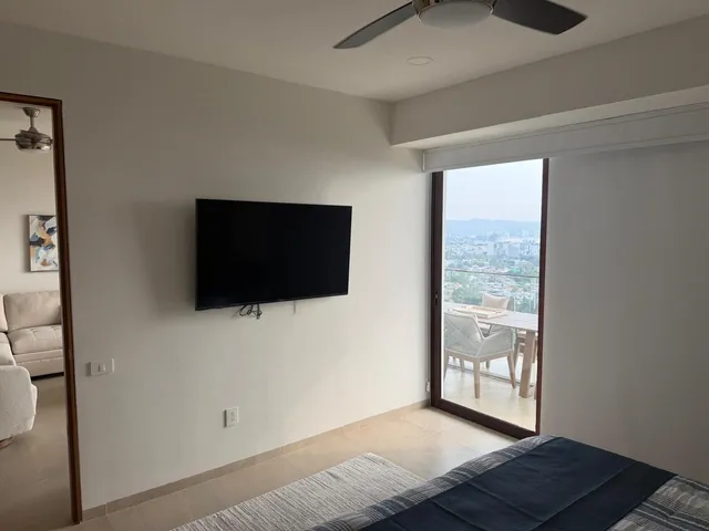 a view of livingroom with furniture and flat screen tv