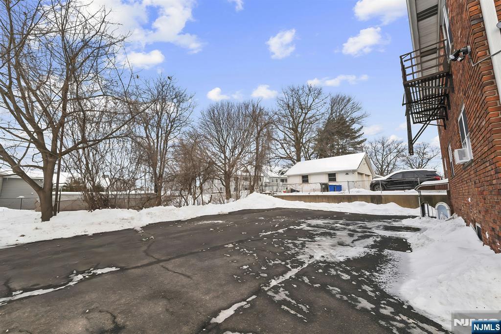 198 Conover Avenue, Unit 4 Nutley, NJ 07110 - Photo 15 of 17 a view of a yard with snow on the road