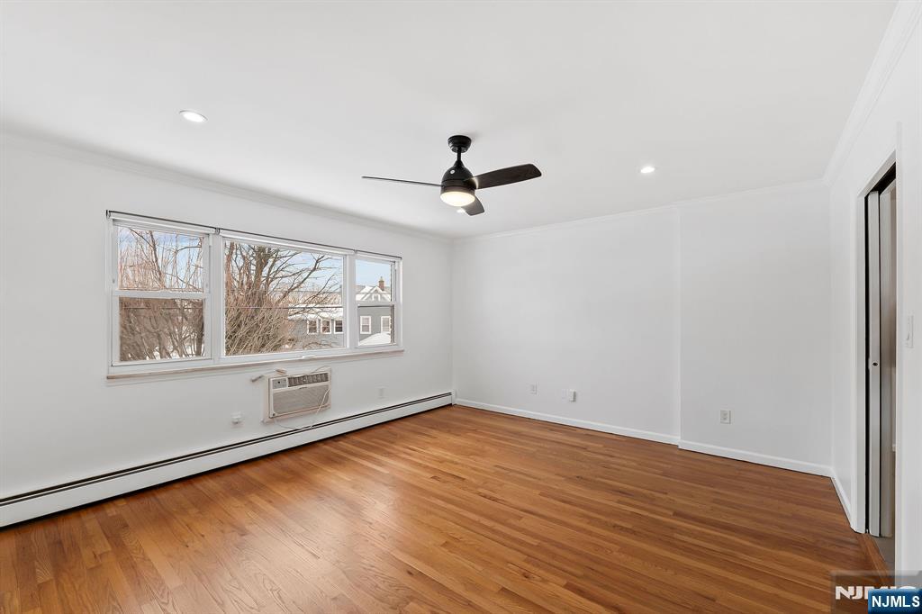 198 Conover Avenue, Unit 4 Nutley, NJ 07110 - Photo 5 of 17 wooden floor in an empty room with a window