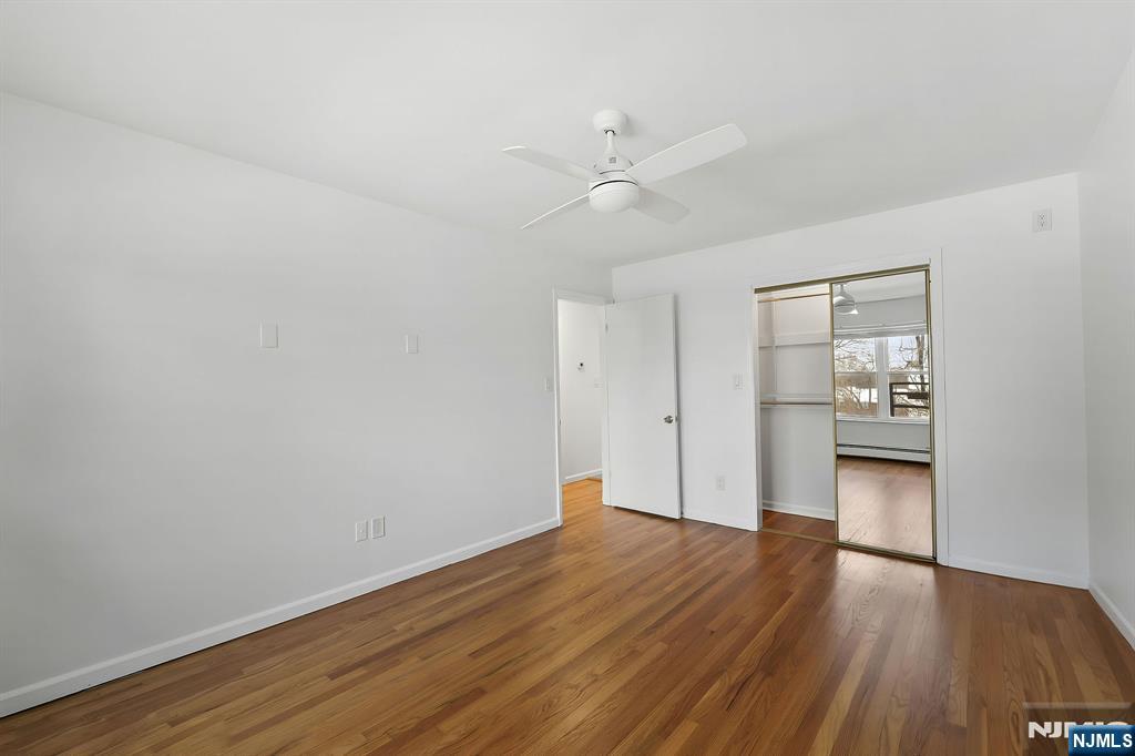 198 Conover Avenue, Unit 4 Nutley, NJ 07110 - Photo 10 of 17 a view of empty room with wooden floor