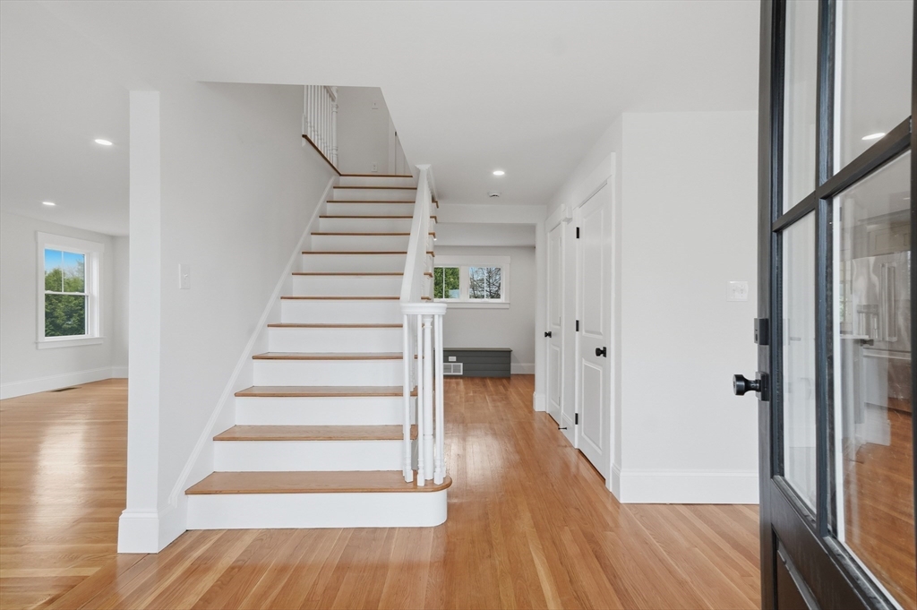 105 Stafford Road Lowell, MA 01852 - Photo 2 of 42 a view of entryway with wooden floor and stairs