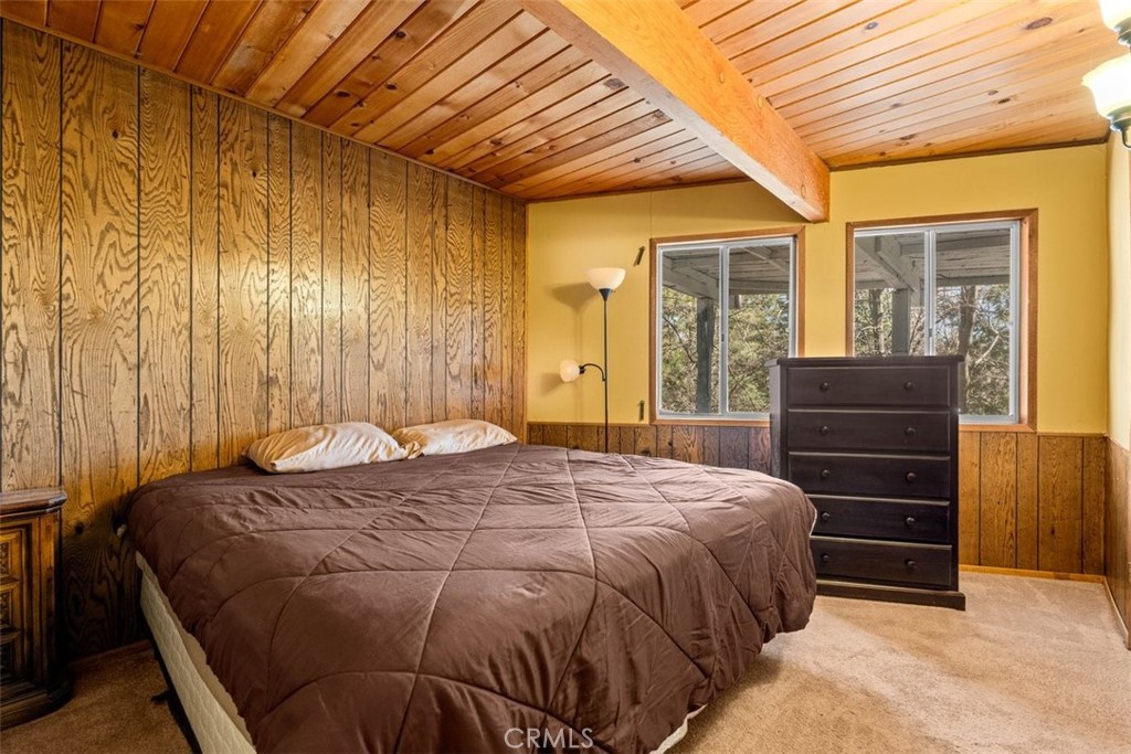 26305 Jacqueline Road Twin Peaks, CA 92391 - Photo 15 of 33 a bed sitting in a spacious bedroom next to a window