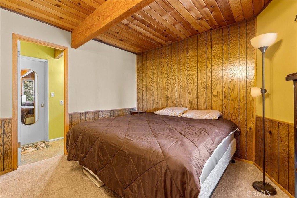 26305 Jacqueline Road Twin Peaks, CA 92391 - Photo 16 of 33 a bedroom with a bed and a large mirror