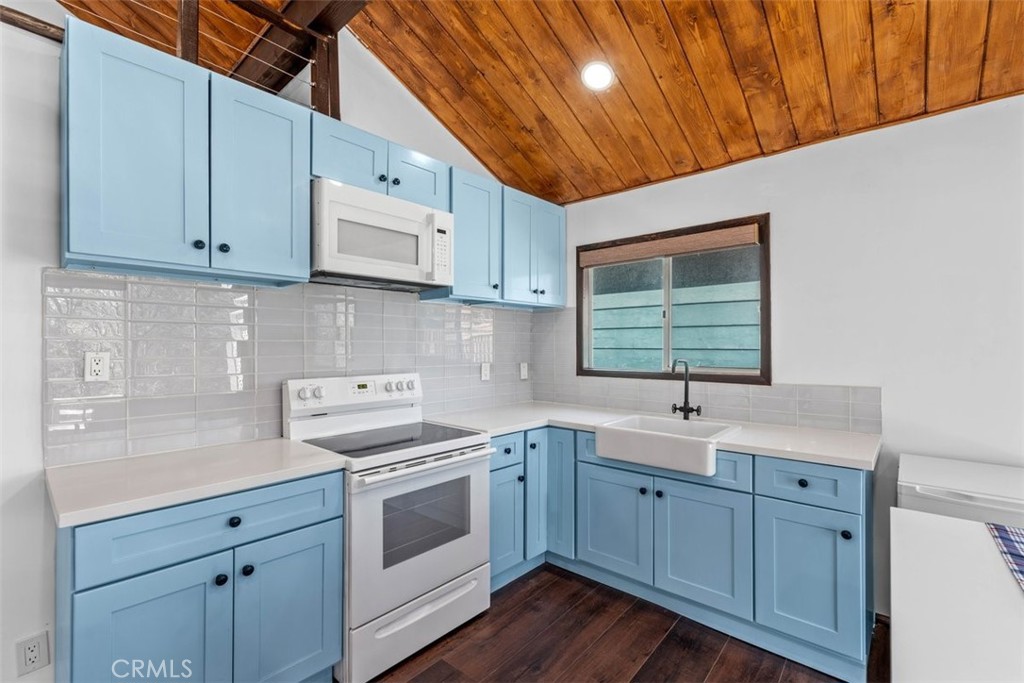 26305 Jacqueline Road Twin Peaks, CA 92391 - Photo 7 of 33 a kitchen with appliances cabinets and a sink