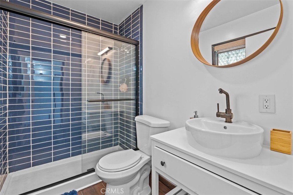 26305 Jacqueline Road Twin Peaks, CA 92391 - Photo 10 of 33 a bathroom with a sink a toilet and a mirror