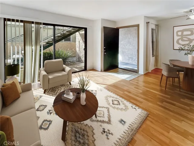 a view of a dining room with furniture wooden floor and chandelier