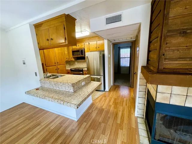 a living room with couch and a dresser