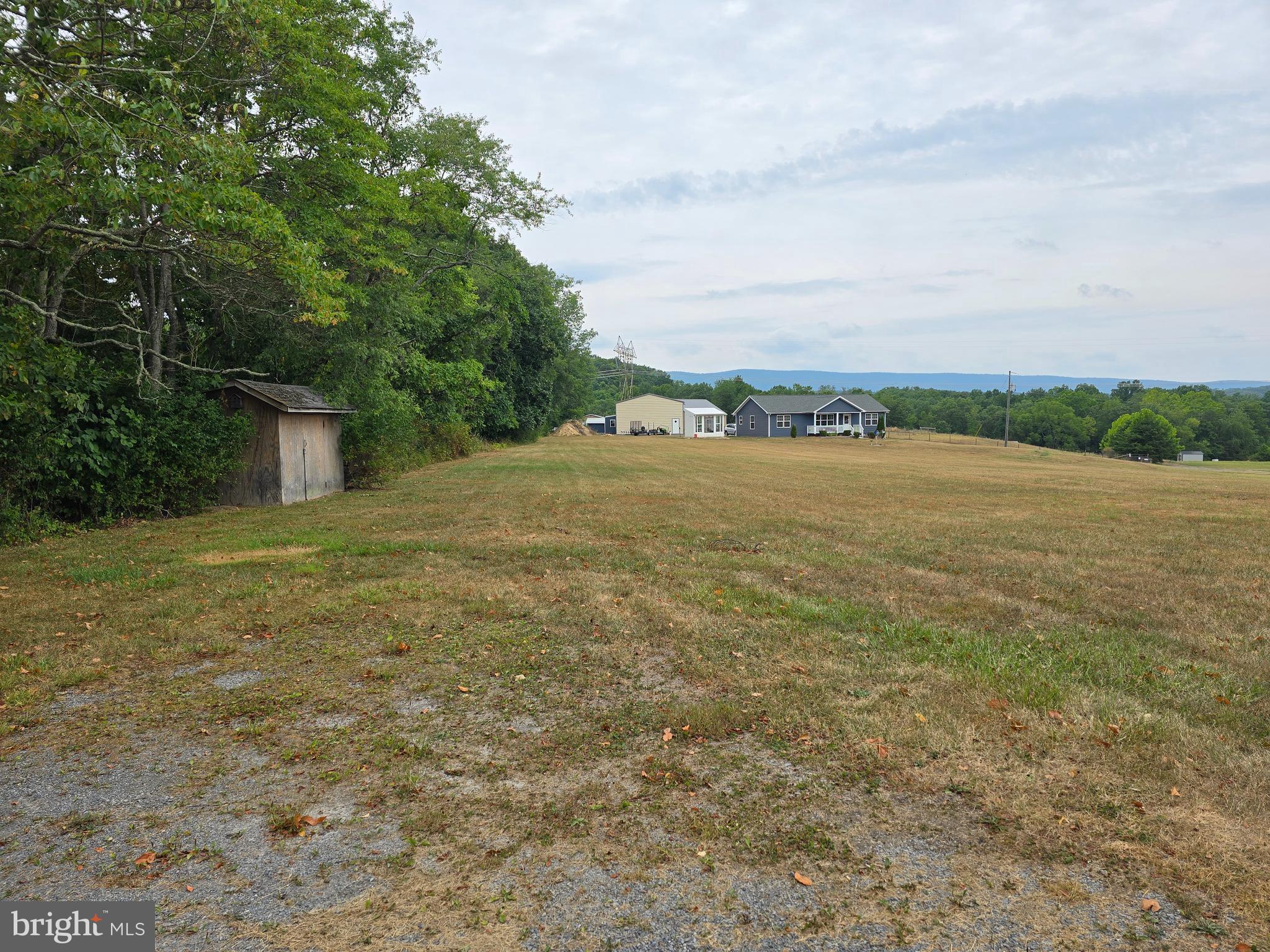 6752 Winchester Grade Road Berkeley Springs, WV 25411 - Photo 47 of 51 View of back yard and storage shed