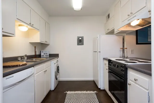 a kitchen with a stove and a sink