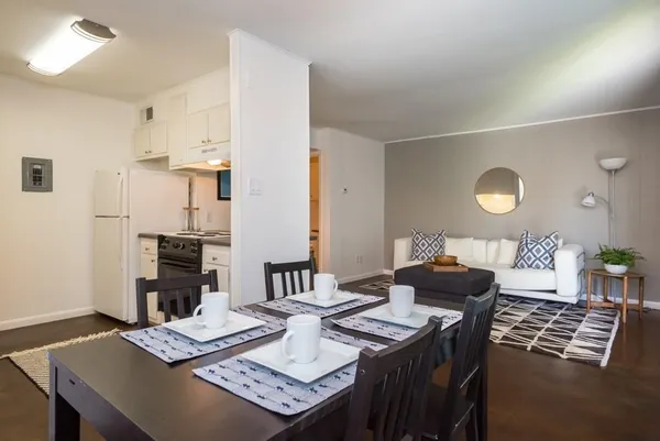 a living room with furniture and a table