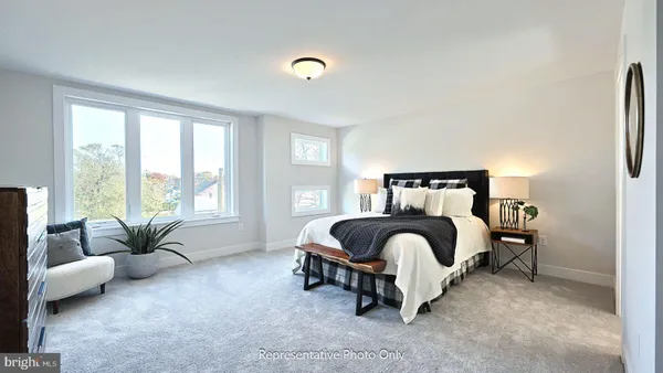 a bedroom with a bed and couch