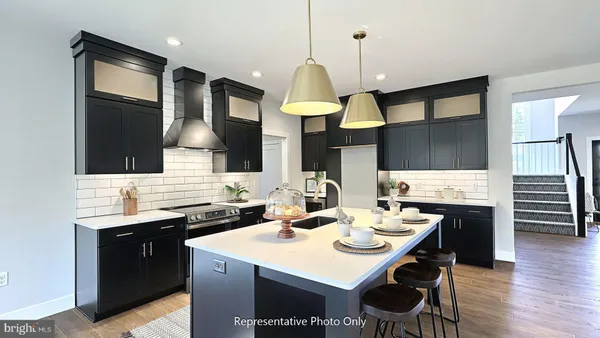 a kitchen with a sink a counter space and appliances