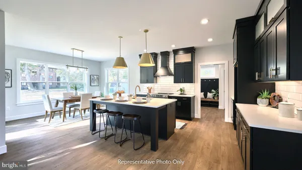 a kitchen with a sink stove and refrigerator