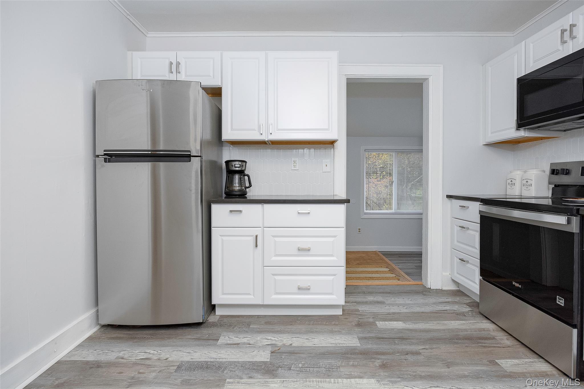 475 East Kerley Corners Road Tivoli, NY 12583 - Photo 9 of 31 a kitchen with stainless steel appliances white cabinets and a refrigerator