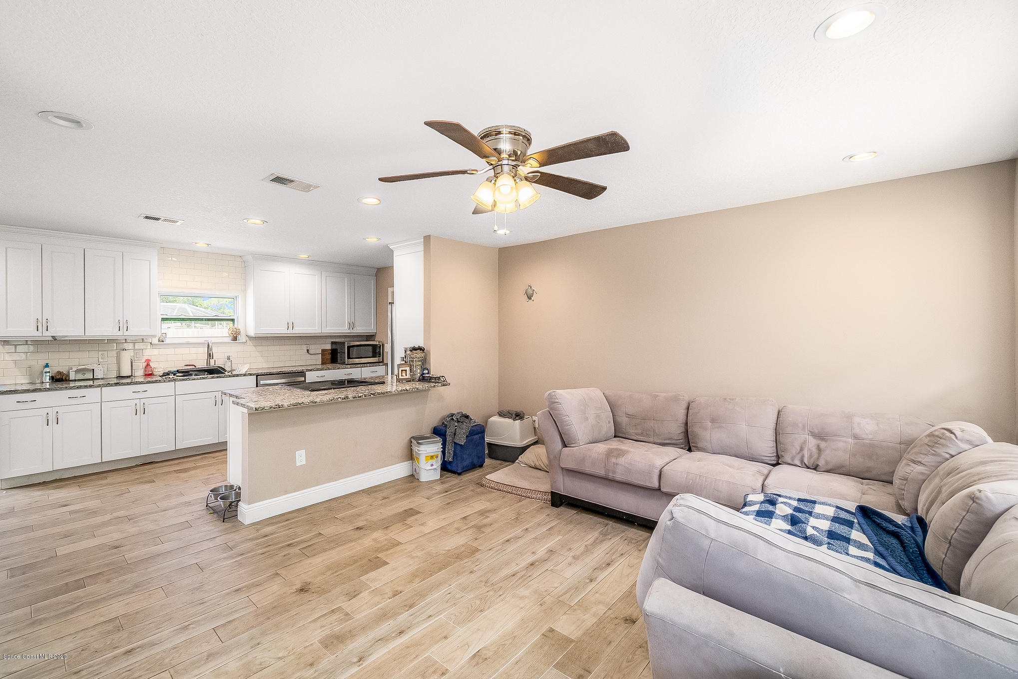 866 Cochran Road Southeast Palm Bay, FL 32909 - Photo 5 of 10 Living Room & Kitchen