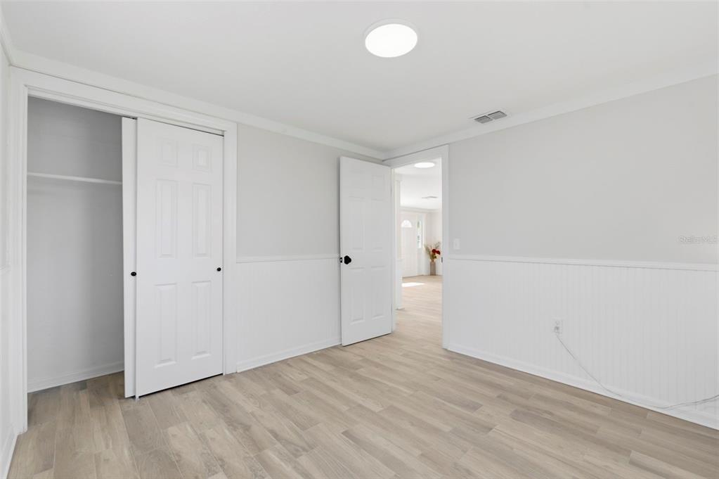 9033 Pegasus Avenue Port Richey, FL 34668 - Photo 31 of 56 a view of empty room with wooden floor