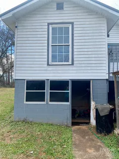 a backyard of a house with seating space