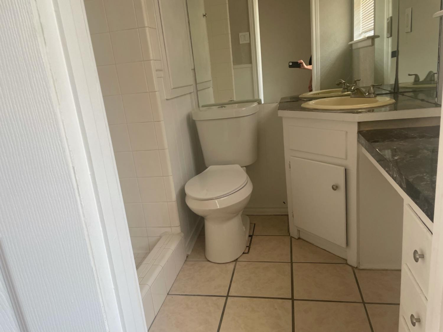 5416 45th Street Lubbock, TX 79414 - Photo 17 of 19 a bathroom with a sink and toilet