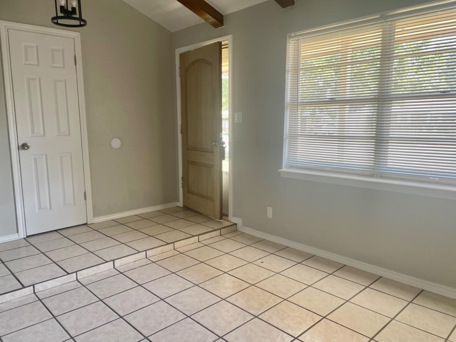 5416 45th Street Lubbock, TX 79414 - Photo 19 of 19 a view of an empty room and window