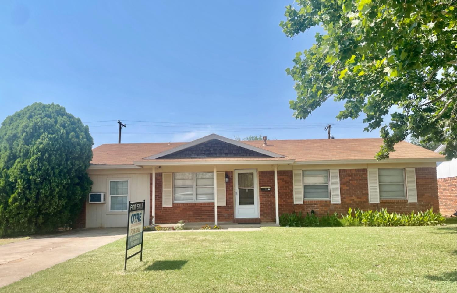 5416 45th Street Lubbock, TX 79414 - Photo 2 of 19 a front view of a house with a yard
