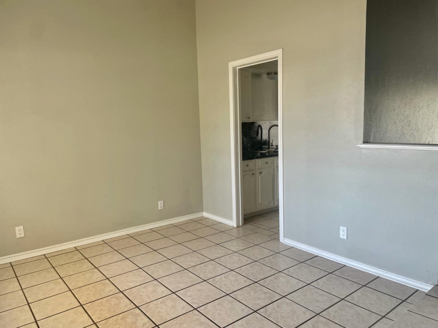 5416 45th Street Lubbock, TX 79414 - Photo 3 of 19 a view of an empty room and wooden shelves