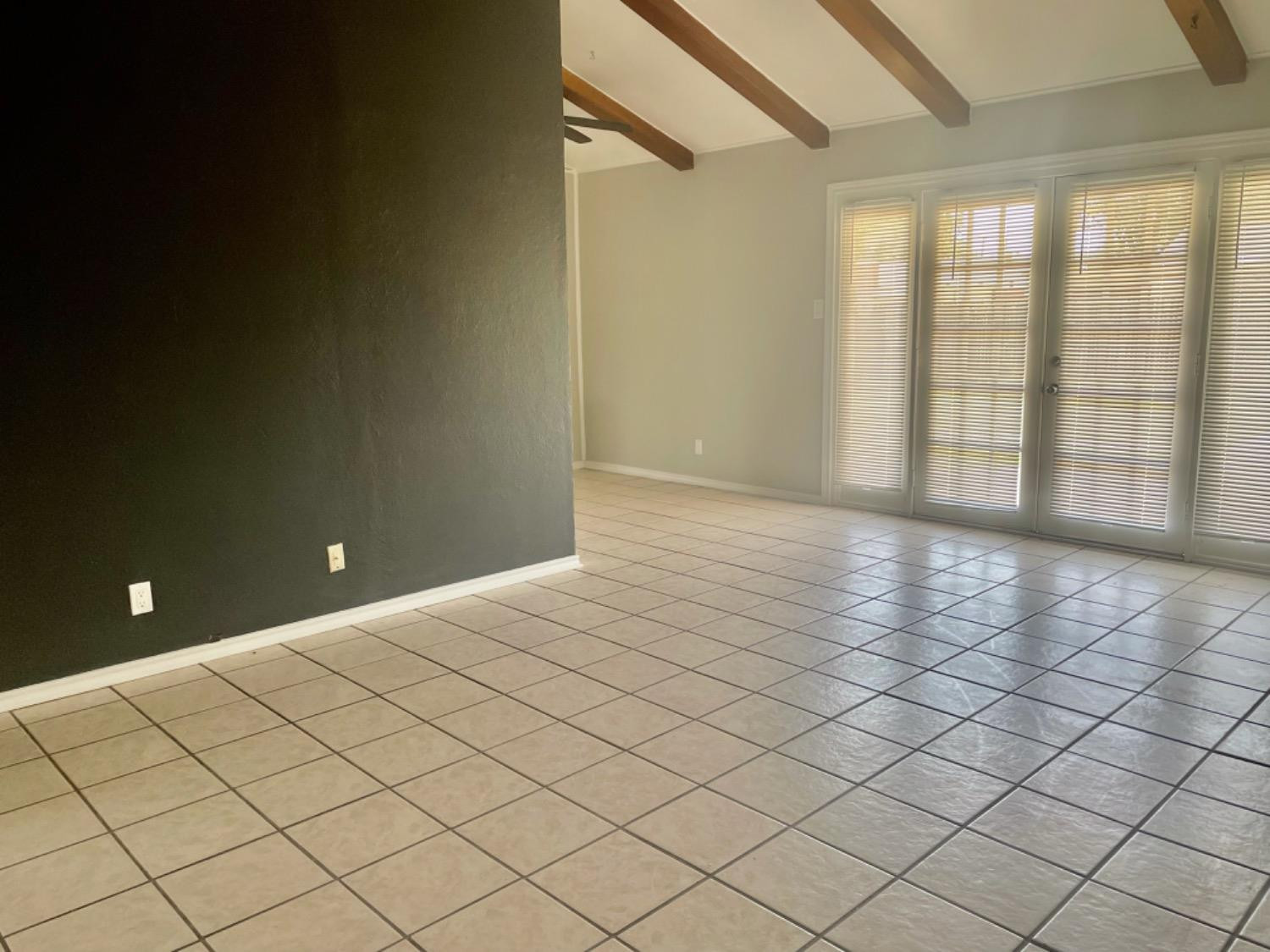5416 45th Street Lubbock, TX 79414 - Photo 6 of 19 a view of an empty room and window