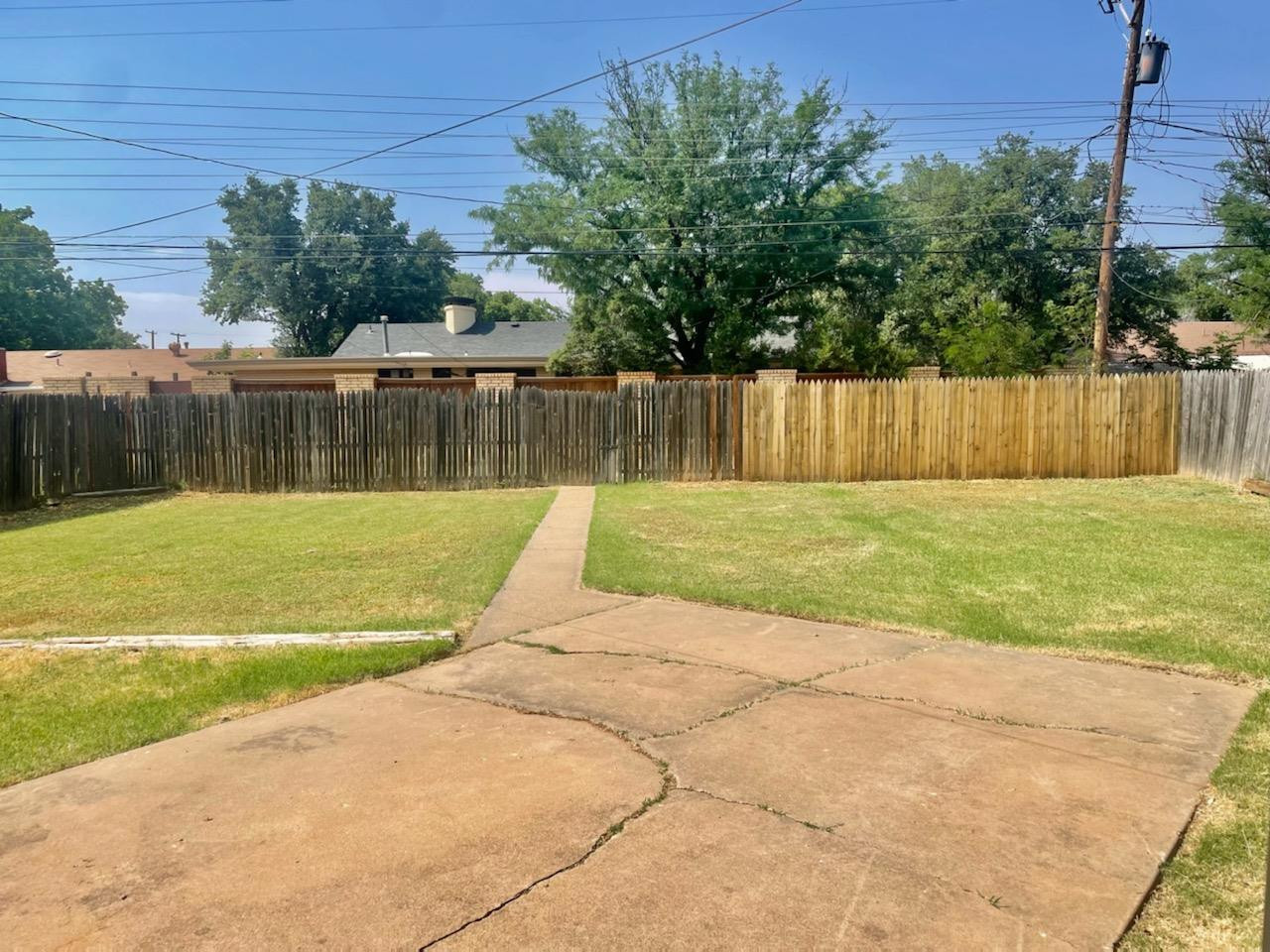 5416 45th Street Lubbock, TX 79414 - Photo 8 of 19 a view of a swimming pool with a backyard