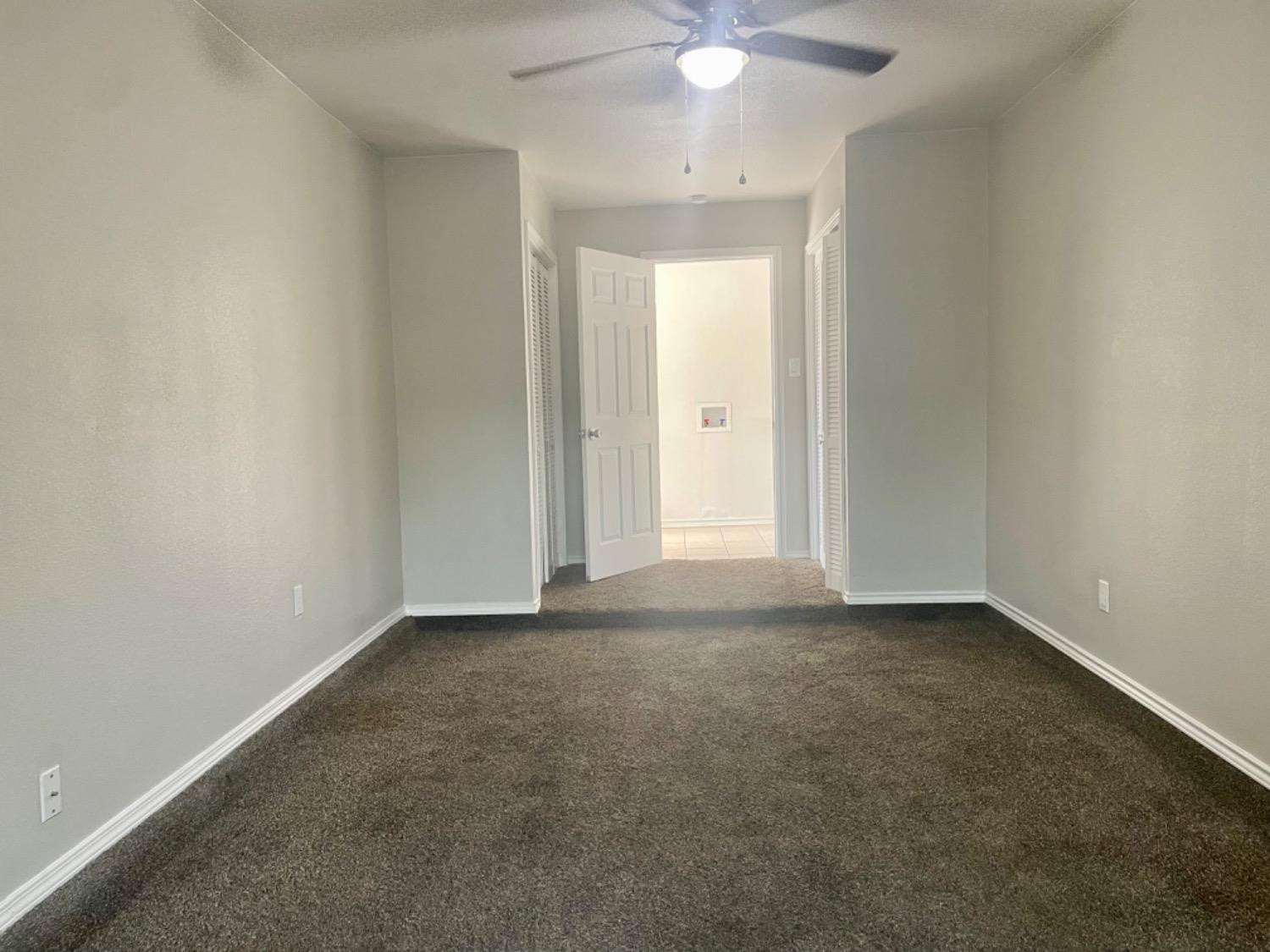 5416 45th Street Lubbock, TX 79414 - Photo 10 of 19 a view of an empty room with a chandelier fan
