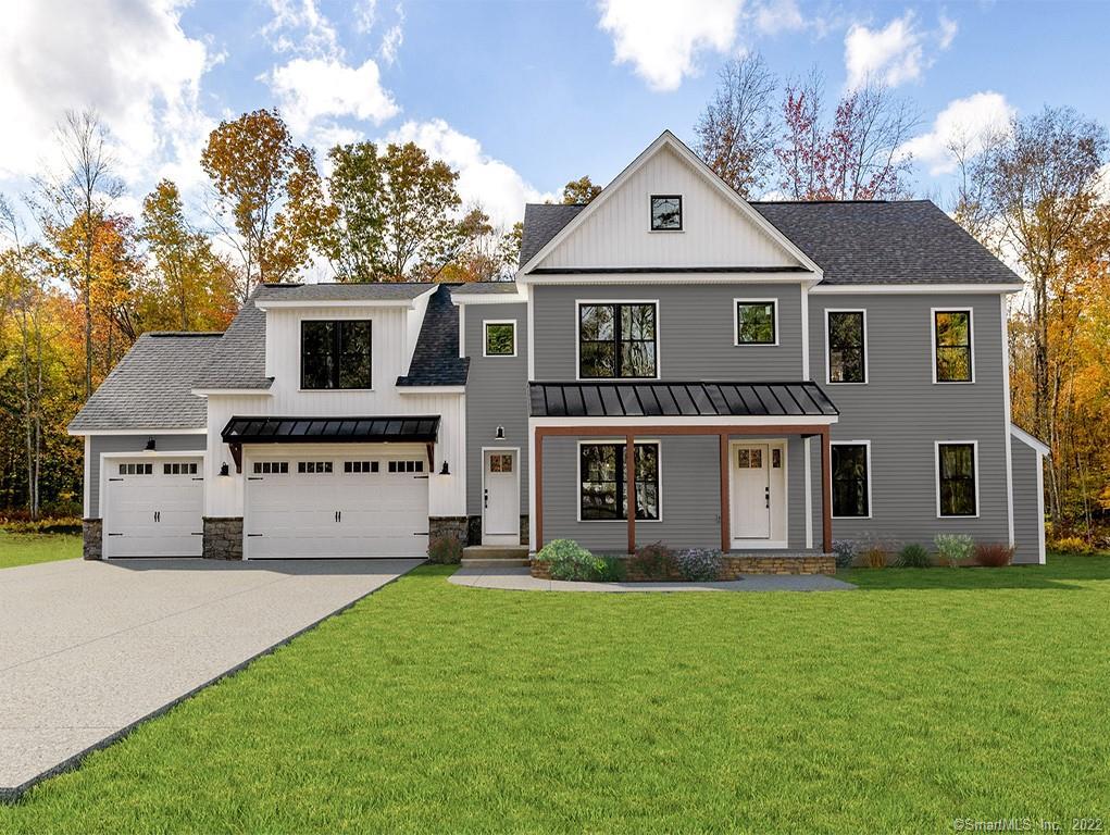 38 Kramer Road Colchester, CT 06415 - Photo 1 of 1 a front view of a house with a garden and trees