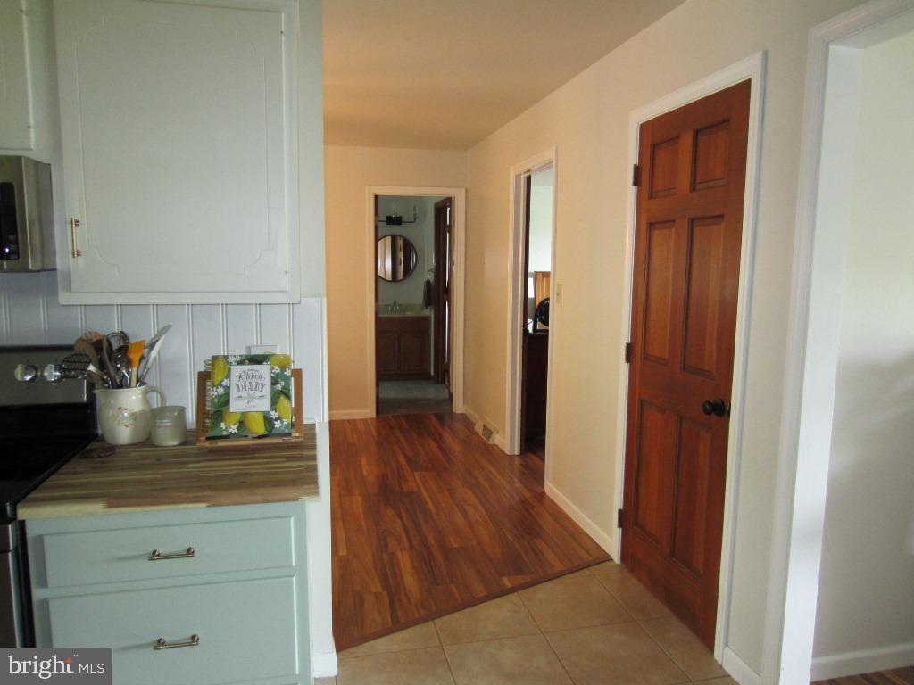 44 Green Acre Road Lititz, PA 17543 - Photo 32 of 66 a kitchen with granite countertop cabinets and wooden floor