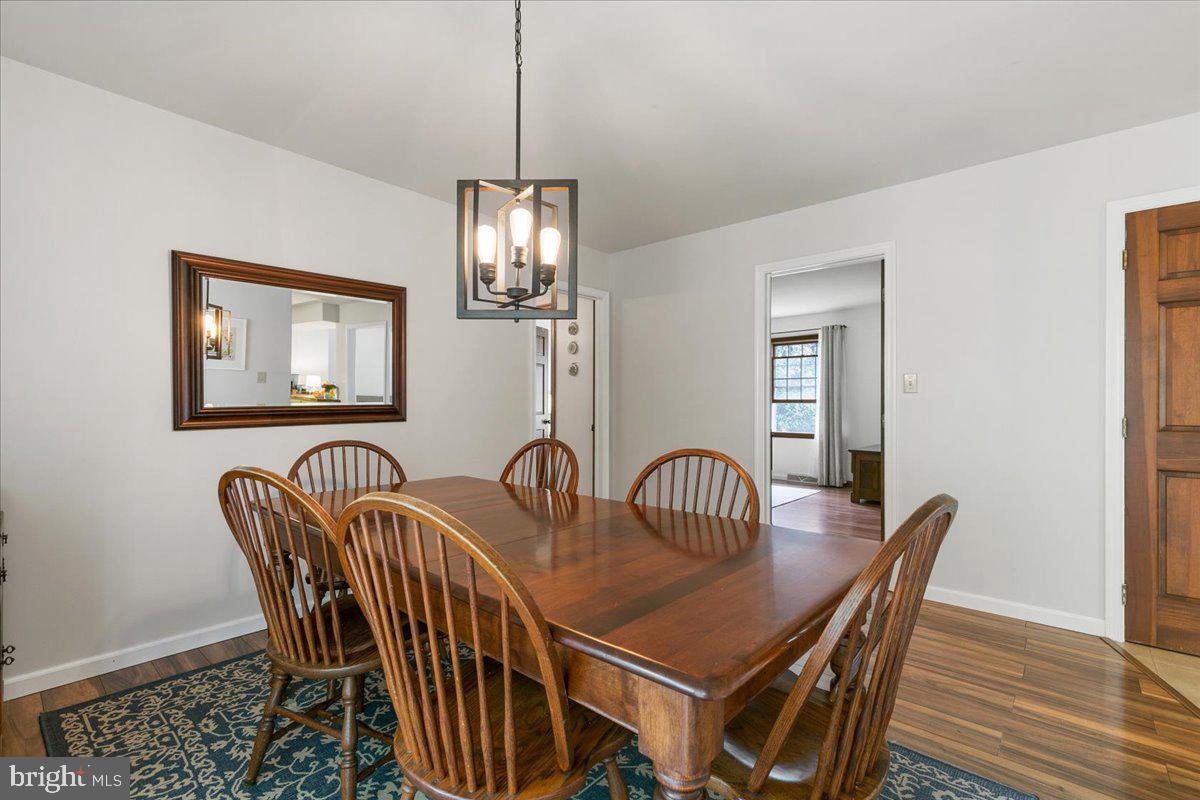 44 Green Acre Road Lititz, PA 17543 - Photo 35 of 66 a dining room with furniture a chandelier and wooden floor