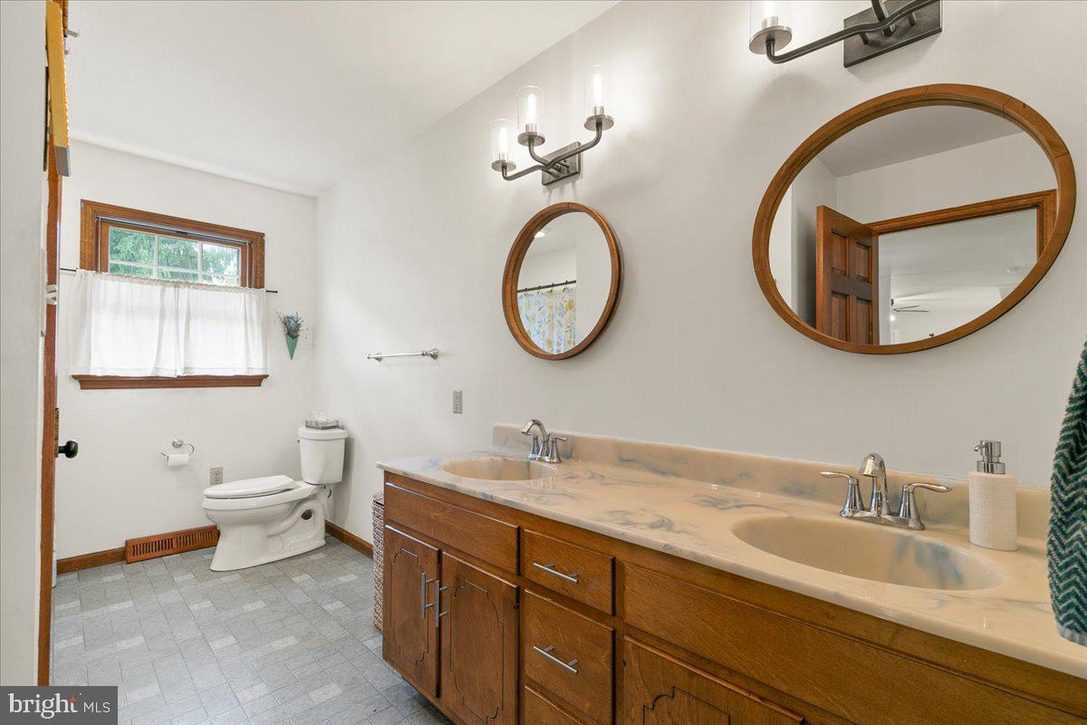 44 Green Acre Road Lititz, PA 17543 - Photo 43 of 66 a bathroom with a toilet a sink and a mirror