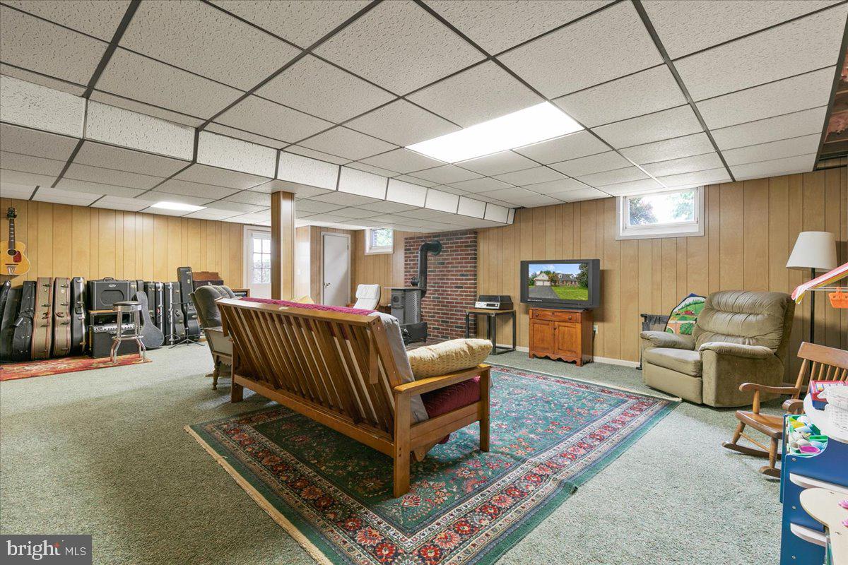 44 Green Acre Road Lititz, PA 17543 - Photo 58 of 66 a living room with furniture a flat screen tv and a table
